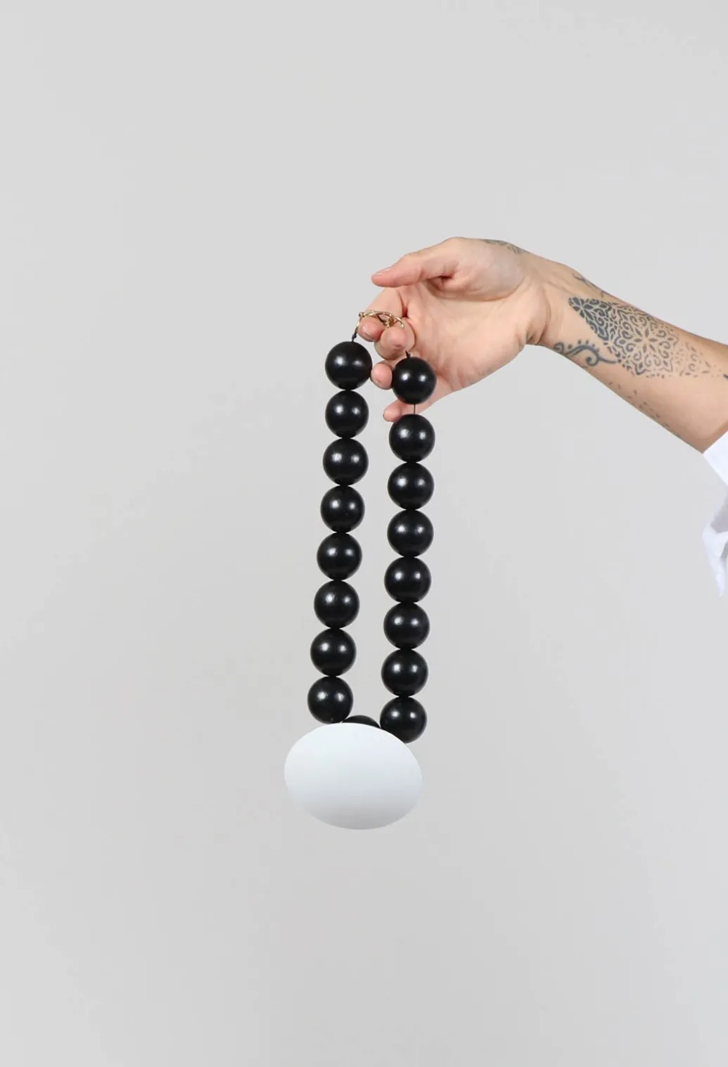 Large Beaded Necklace with Black Pendant in Black