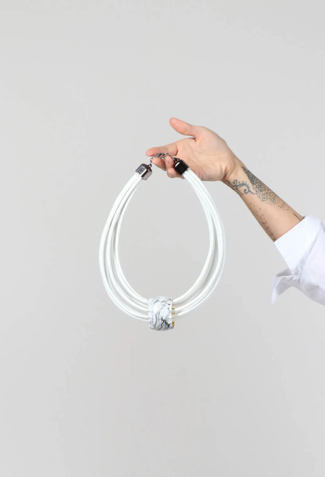 Multistrand Necklace With White Metal Pendant