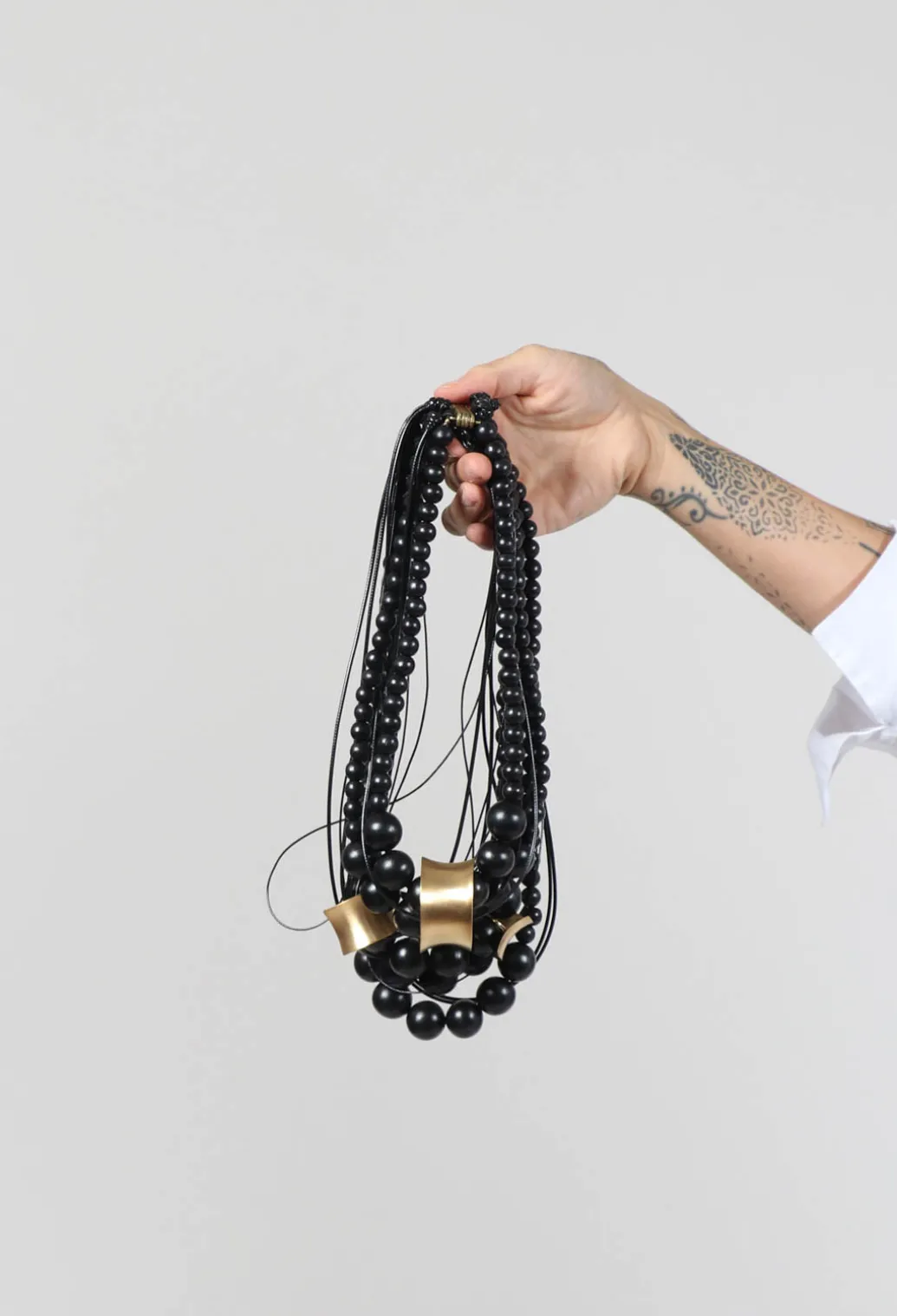 Multistrand Necklace with Beads and Metal Pendants