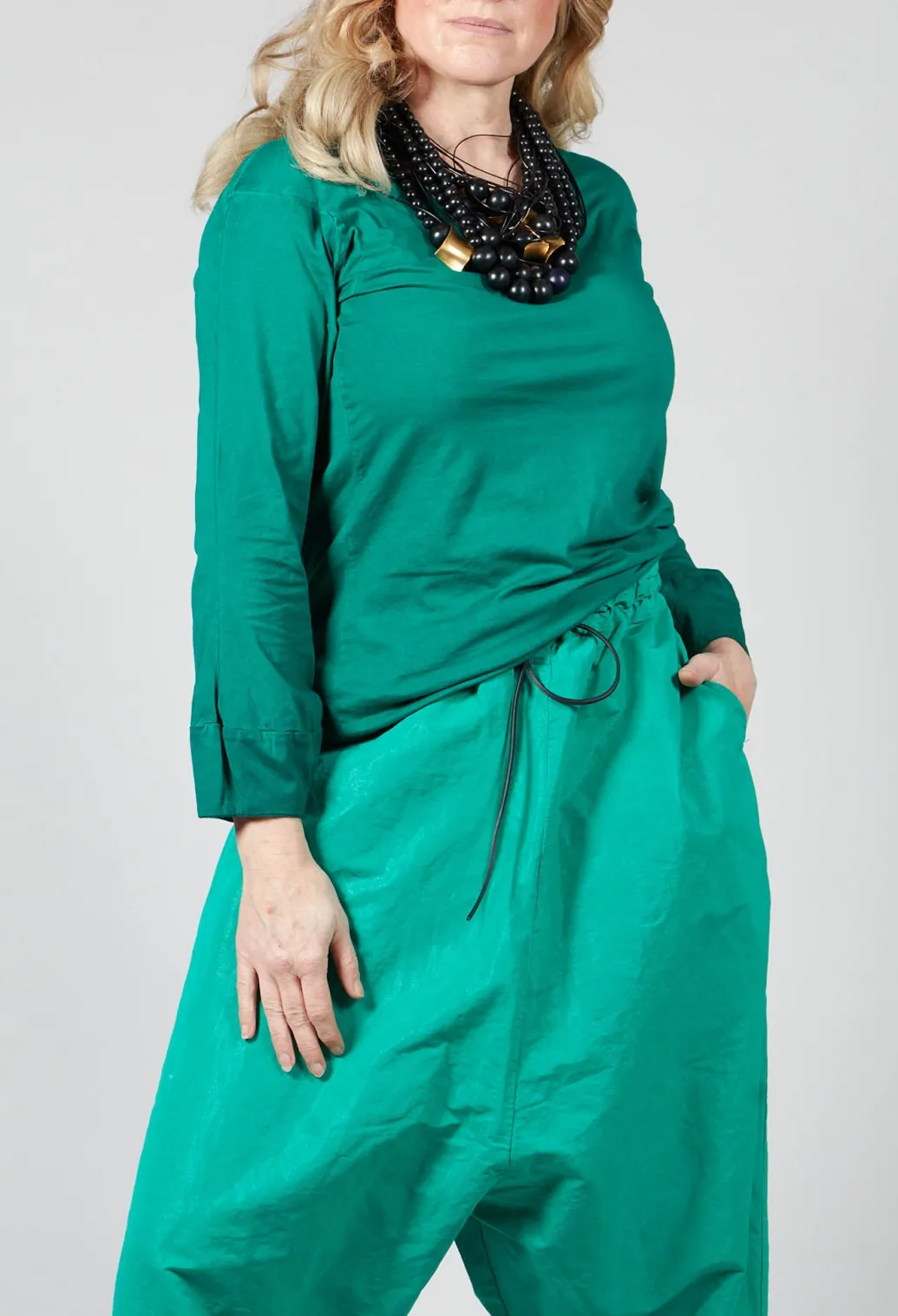 Round Neck Long Sleeved T Shirt with Bell Sleeves in Green